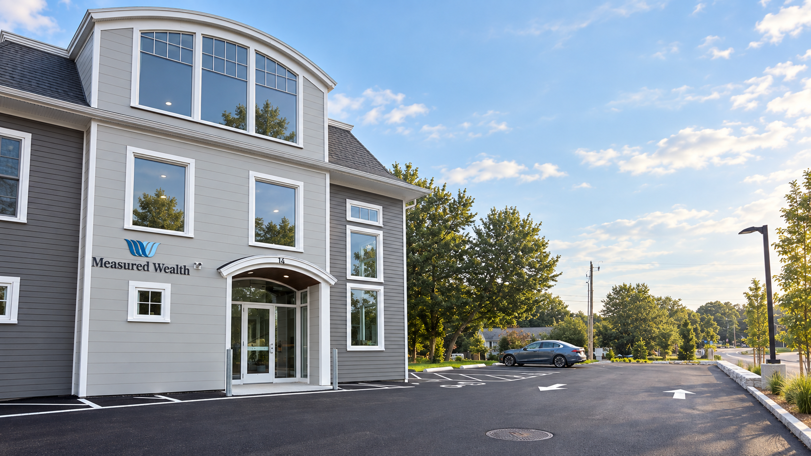 The Measured Wealth office at 14 Sagamore Road in Rye, NH, with its parking area and Sagamore Road alongside.